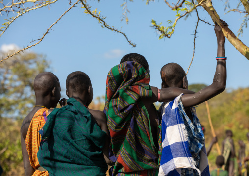 Suri tribe women watching a donga stick fighting ritual, Omo valley, Kibish, Ethiopia