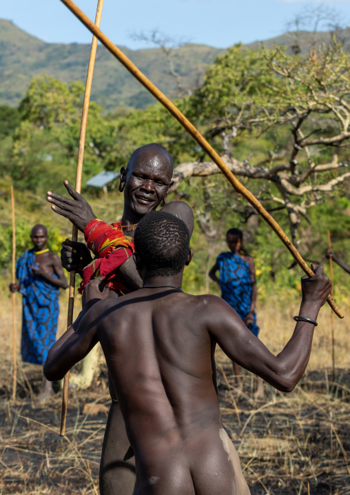 Suri tribe warriors fighting during a donga stick ritual, Omo valley, Kibish, Ethiopia