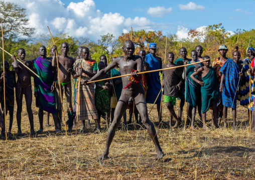 Suri tribe warriors fighting during a donga stick ritual, Omo valley, Kibish, Ethiopia