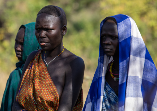 Suri tribe women watching a donga stick fighting ritual, Omo valley, Kibish, Ethiopia