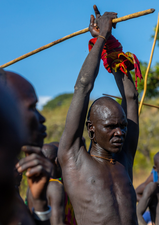 Suri tribe warriors fighting during a donga stick ritual, Omo valley, Kibish, Ethiopia