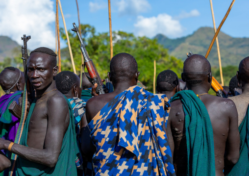 Group of suri tribe warriors during a donga stick fighting ritual, Omo valley, Kibish, Ethiopia