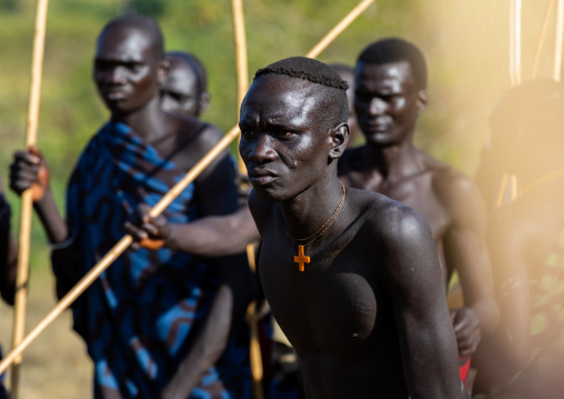 Suri tribe warriors parading before a donga stick fighting ritual, Omo valley, Kibish, Ethiopia