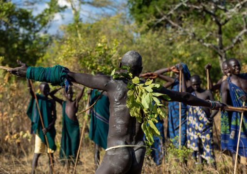 Suri tribe warriors parading before a donga stick fighting ritual, Omo valley, Kibish, Ethiopia