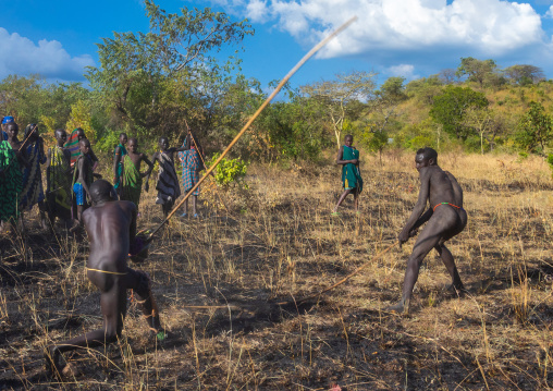 Suri tribe warriors fighting during a donga stick ritual, Omo valley, Kibish, Ethiopia