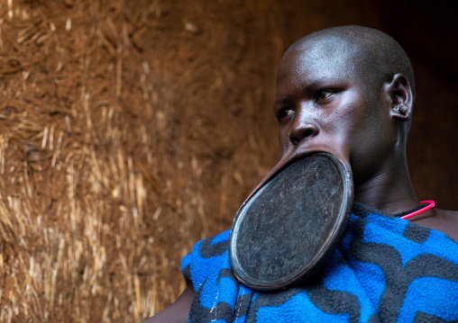 Portrait of a suri tribe woman wearing a huge lip plate, Omo valley, Kibish, Ethiopia