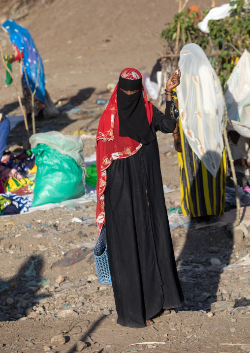 Oromo woman wearing a burqa in the market, Amhara region, Senbete, Ethiopia