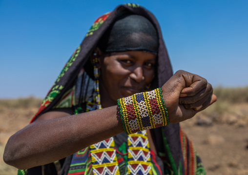 Portrait of an issa tribe woman with a beaded bracelet, Afar Region, Gewane, Ethiopia