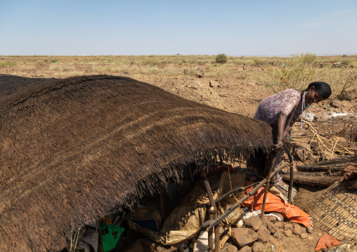 Issa woman making tent in a camp, Afar Region, Gewane, Ethiopia