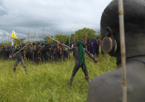 Suri tribe warriors fighting during a donga stick ritual, Omo valley, Tulgit, Ethiopia
