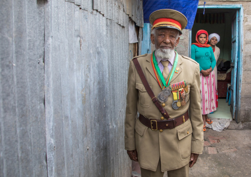 Ethiopian veteran from the italo-ethiopian war in army uniform in the courtyard of his house, Addis Ababa Region, Addis Ababa, Ethiopia