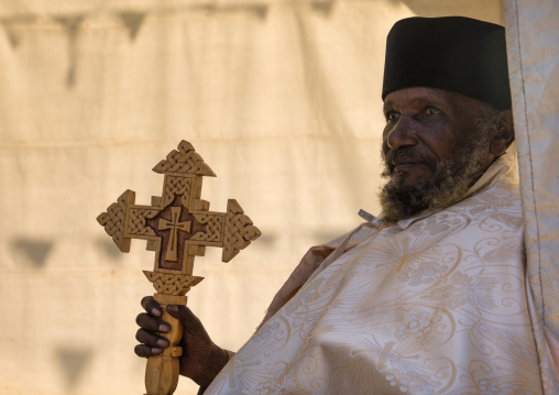 Priest with a cross in Entoto orthodox Maryam Church, Addis Ababa Region, Addis Ababa, Ethiopia