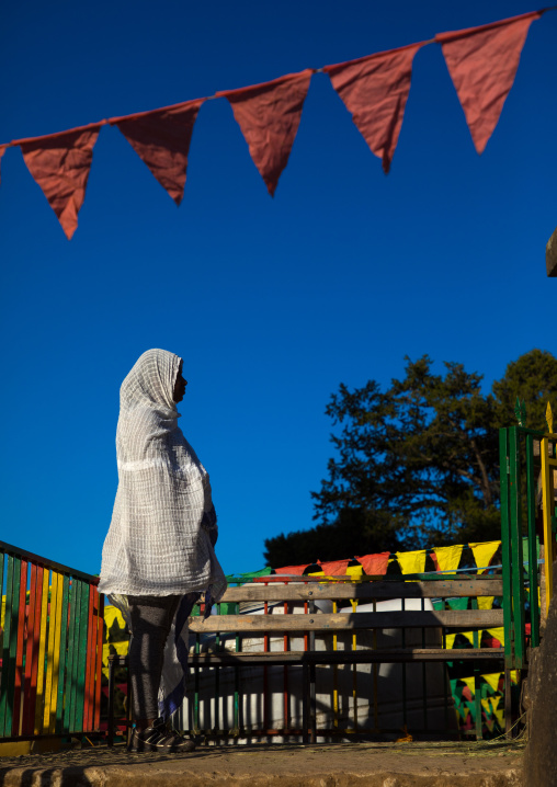 Ethiopian pilgrim woman praying at Entoto orthodox Maryam Church, Addis Ababa Region, Addis Ababa, Ethiopia