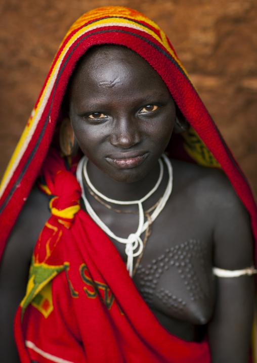 Suri tribe woman with traditional scarifications, Kibish, Omo valley, Ethiopia