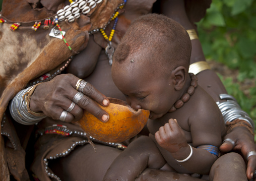 Baby Drinking At A Bull Jumping Ceremony, Turmi, Omo Valley, Ethiopia