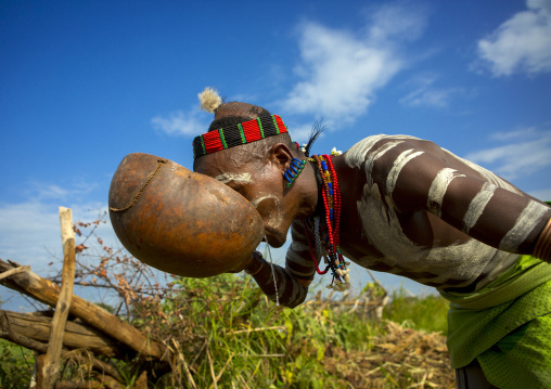 Bashada Tribe Man Drinking In A Calabash, Dimeka, Omo Valley, Ethiopia