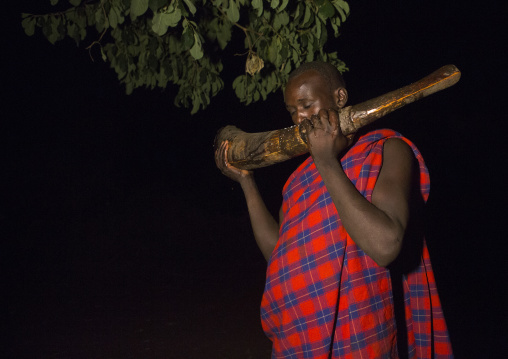 Bodi Tribe Man Blowing In An Elephant Tusk During The Kael Ceremony, Hana Mursi, Omo Valley, Ethiopia