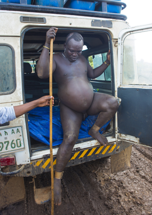 Bodi Tribe Fat Man In A Four Wheel Car During Kael Ceremony, Hana Mursi, Omo Valley, Ethiopia