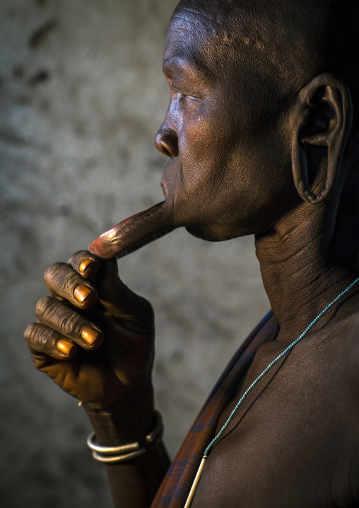 Portrait Of A  Mursi Tribe Woman With Enlarged Lip In Mago National Park, Omo Valley, Ethiopia