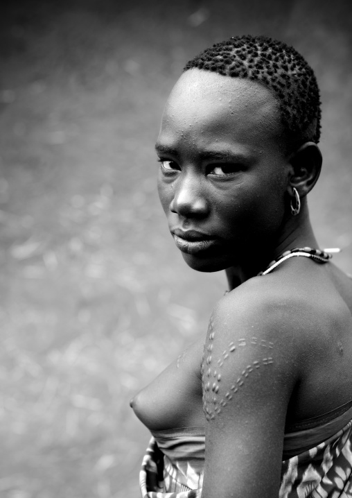 Black And White Portrait Of Miss Bichai, Young Bodi Tribe Woman With Traditional Hairstyle And Scarifications, Hana Mursi, Omo Valley, Ethiopia