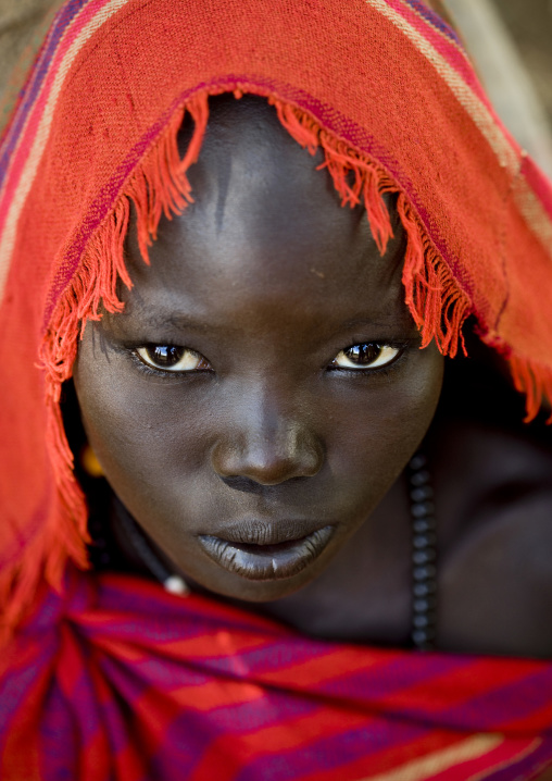 Portrait Of A Young Bodi Tribe Woman With Red Scarf, Omo Valley, Ethiopia