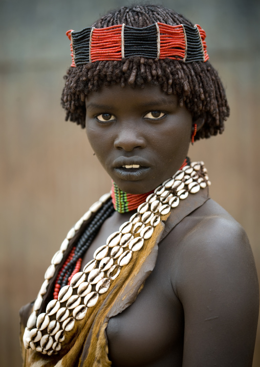 Portrait Of A Hamar Tribe Woman With Headband And Traditional Shell Necklace, Turmi, Omo Valley, Ethiopia