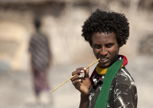 Afar man with  traditional toothbrush, Assaita, Afar regional state, Ethiopia