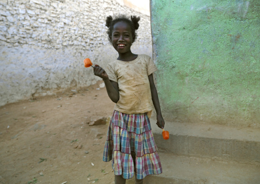 Little Girl Wit Ice Cream In The Street, Harar, Ethiopia