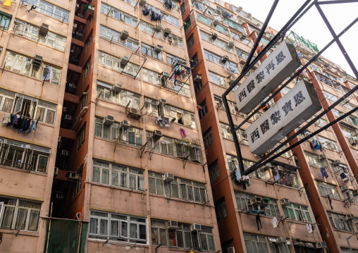 Facades of old apartments towesr in a very crowded district, Special Administrative Region of the People's Republic of China , Hong Kong, China