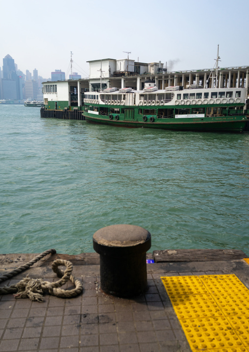A star ferry leaving its Tsim Sha Tsui pier in kowloon to reach the central pier, Kowloon, Hong Kong, China