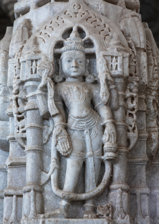 Carved idol made of white marble on the wall of Tirthankar jain temple, Rajasthan, Ranakpur, India