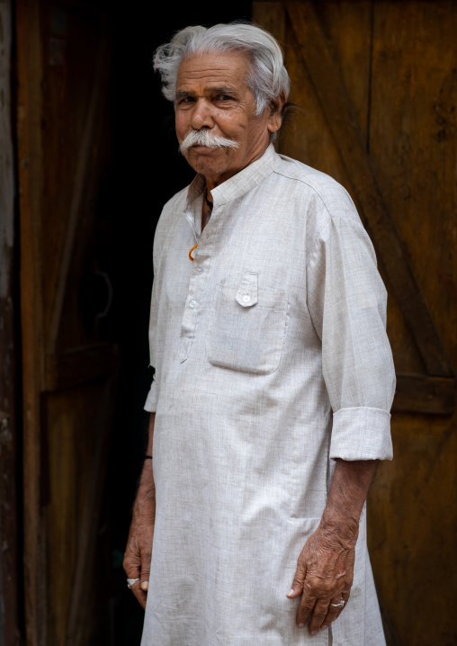 Portrait of an indian man in white clothes in the street, Rajasthan, Bundi, India