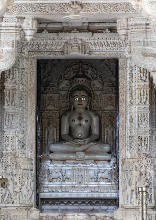 Carved idol made of white marble on the wall of Tirthankar jain temple, Rajasthan, Ranakpur, India