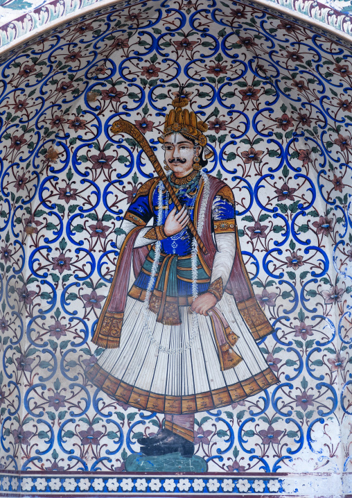 Ancient murals depicting an indian rich man in the city palace, Rajasthan, Jaipur, India