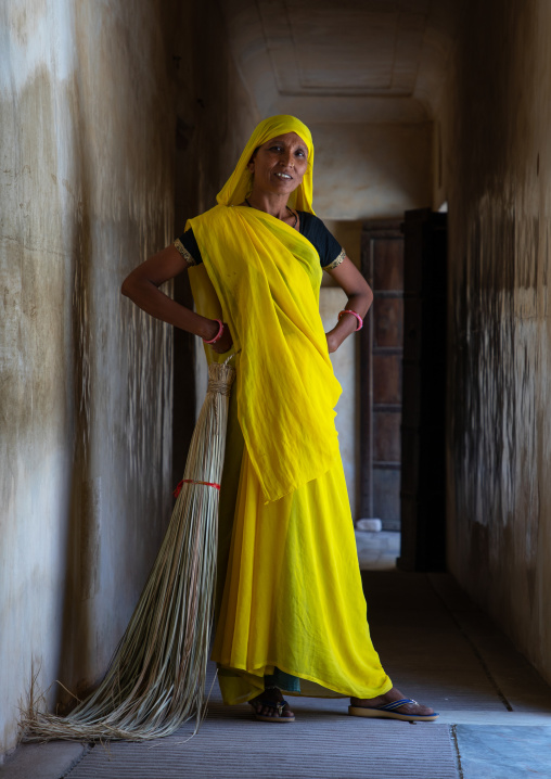 Portrait of a rajasthani woman in traditional yellow sari in nahargarh fort, Rajasthan, Amer, India