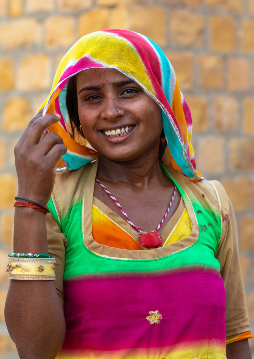 Portrait of a smiling rajasthani woman in traditional clothing, Rajasthan, Jaisalmer, India