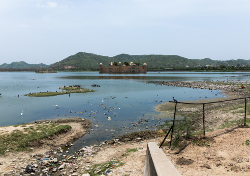 Pollution and garbages in front of jal mahal water palace on man sagar lake, Rajasthan, Jaipur, India