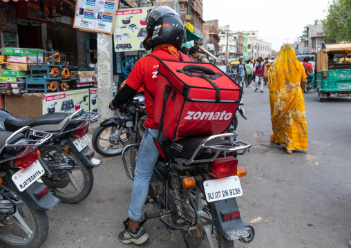 A biker from the popular take away food delivery company Zomato, Rajasthan, Bikaner, India