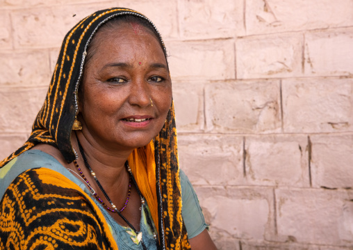 Portrait of a smiling rajasthani woman in traditional sari, Rajasthan, Jaisalmer, India