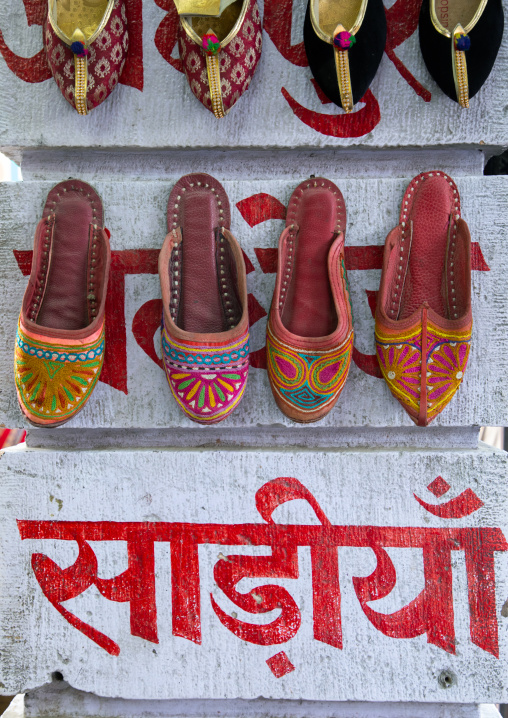 Traditional shoes hanging on the wall, Rajasthan, Jodhpur, India
