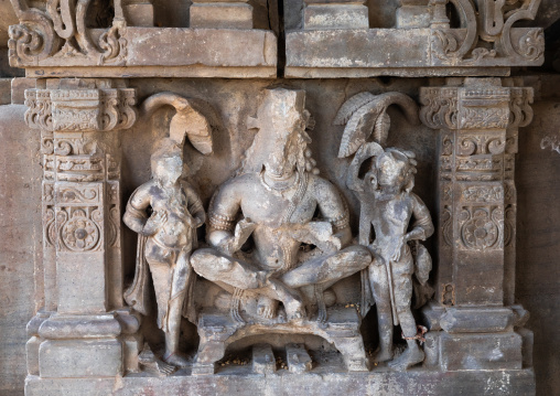 Carved idols with broken faces on the wall of Harshat Mata temple, Rajasthan, Abhaneri, India