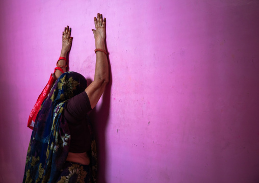 Indian woman praying in Giriraj dharan mandir, Rajasthan, Dausa, India