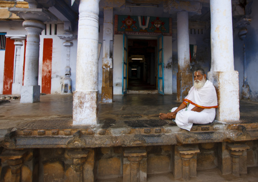 Old Priest With A White Beard Meditating At The Entrance Of The Sri Ranganathaswamy Temple, Trichy, India