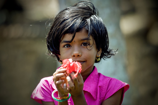 Alleppey Kid In Kerala Holding A Flower In Her Hands, India