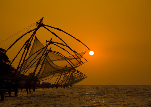 Chinese Fishing Nets In Silhouette At Sunset, Kochi, India