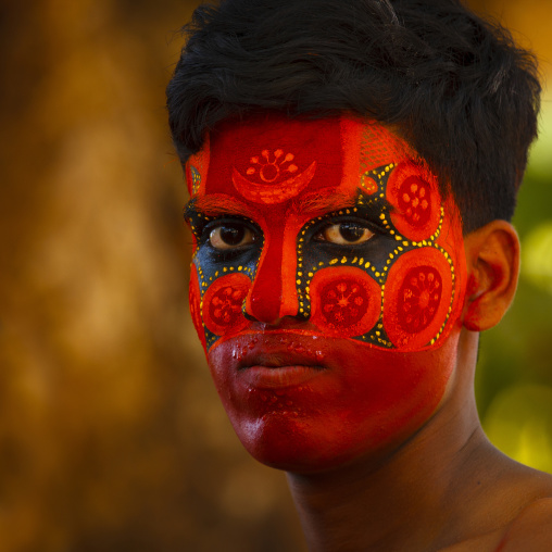 Man With Traditional Makeup On His Face For Theyyam Ceremony, Thalassery, India