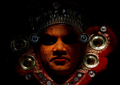 Portrait Of A Theyyam Artist With Traditional Makeup On His Face Dressed For The Ritual, Thalassery, India