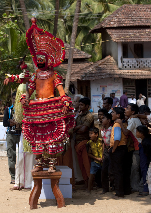 Theyyam Dancers On Stools Performing Theyyam Ritual Among A Impressed Audience, Thalassery, India