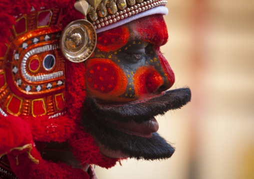 Man Dressed For Theyyam Ritual With Traditional Painting On His Face, Thalassery, India