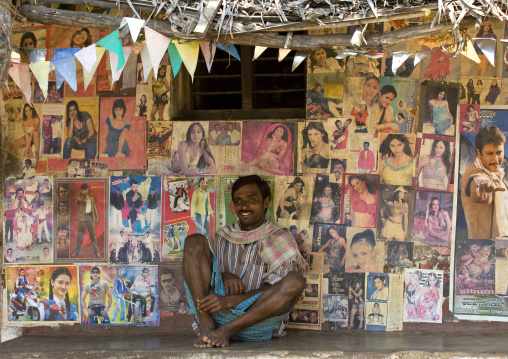 Man Sitting In Front Of His House Covered With Bollywoods Posters, Mysore, India
